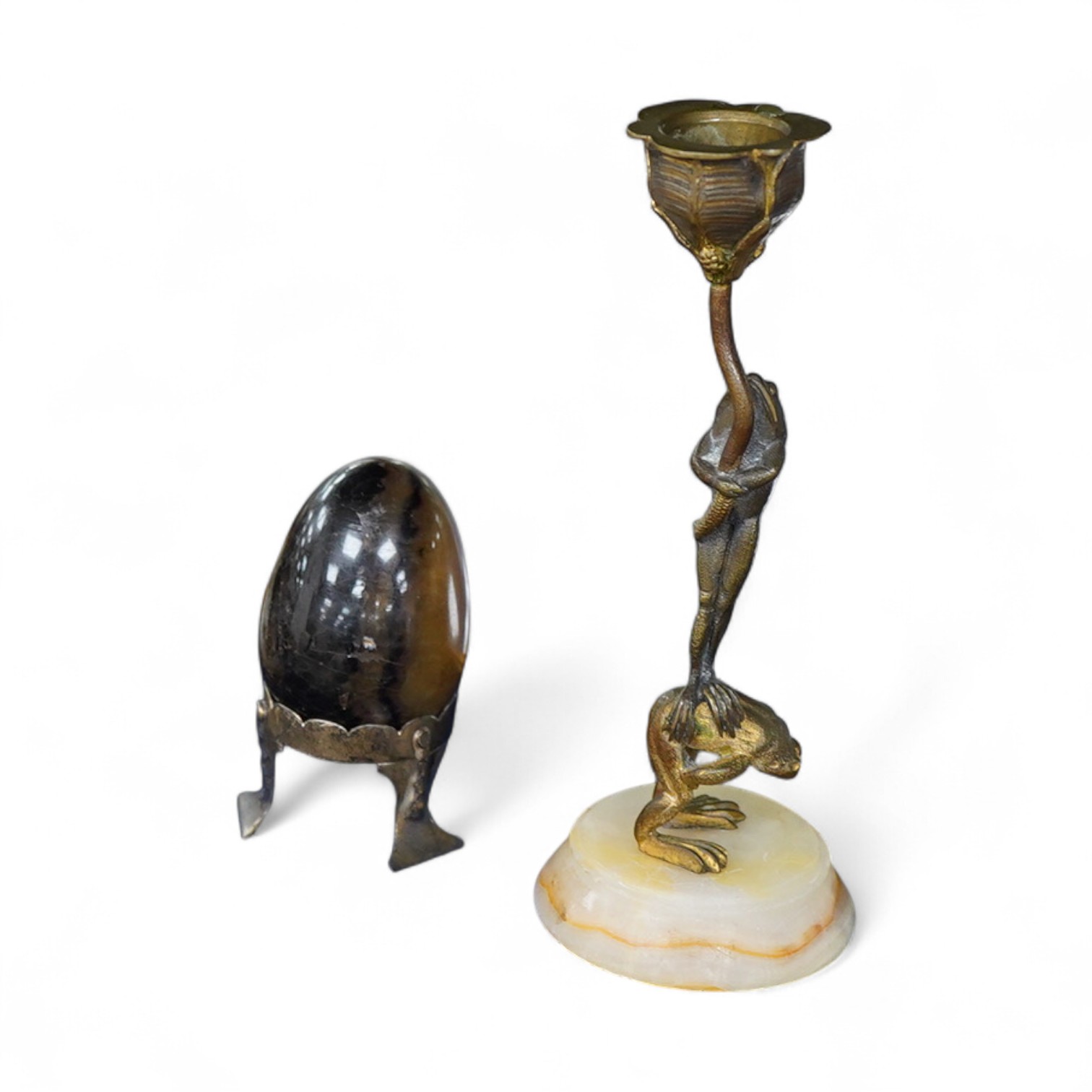 A Blue John egg, on white metal stand, an ormolu and alabaster candlestick cast as frogs, 18cm high, a French champleve, ormolu and alabaster holy water stoup and a gilt brass easel-back photograph frame